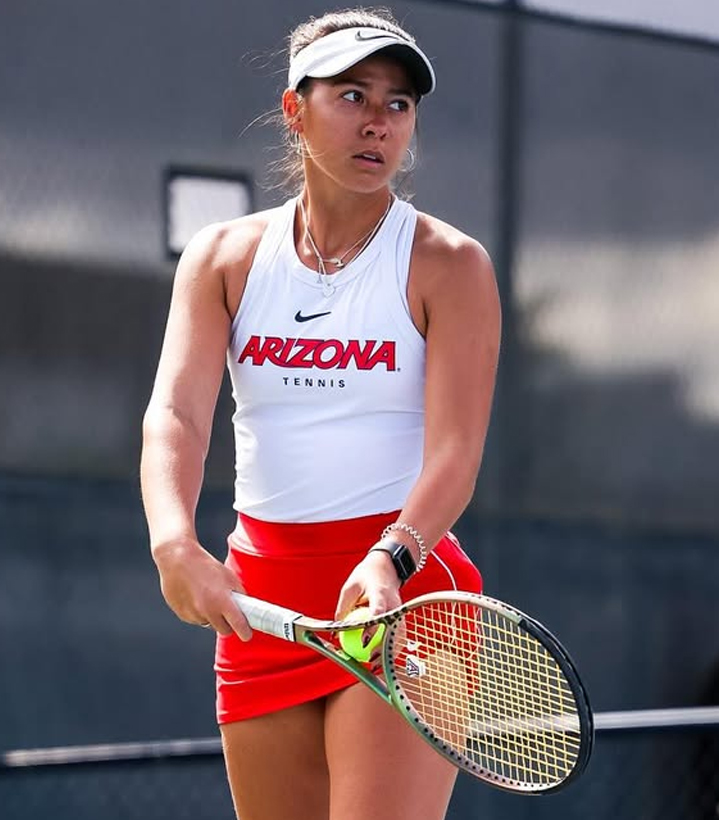 Student-athlete competing in university tennis